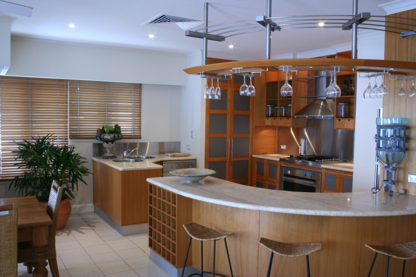 Mid-century modern kitchen with onyx countertop and curved counter, open floor plan