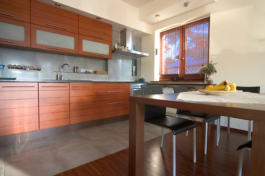 Modern kitchen and dining area with wood cabinetry