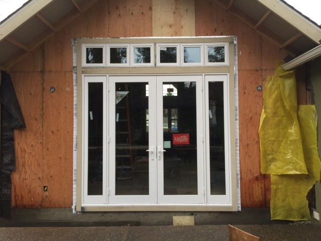 Framed-in new French doors in partially constructed home