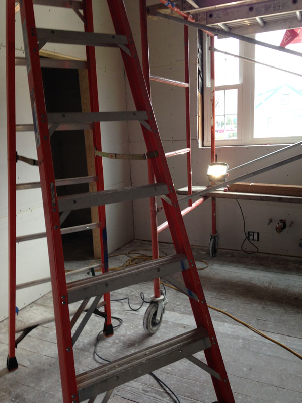 red ladder in interior contstruction site