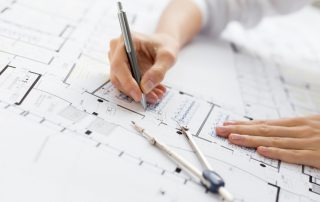 architect hands drawing architectural plans