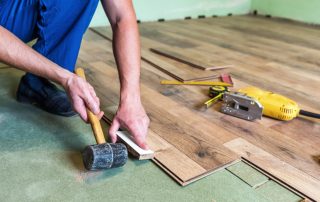 Contractor installing flooring