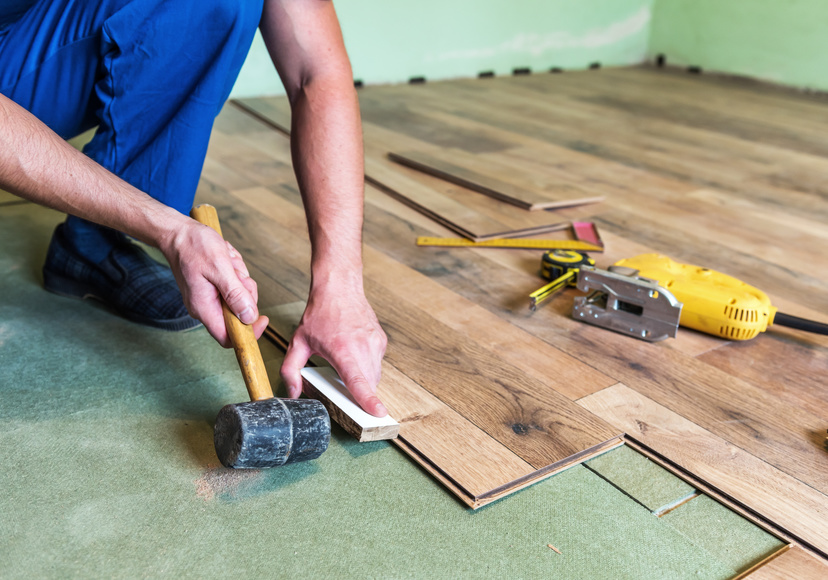 Contractor installing flooring