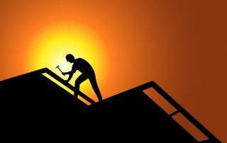 Roofing worker on a new roof.