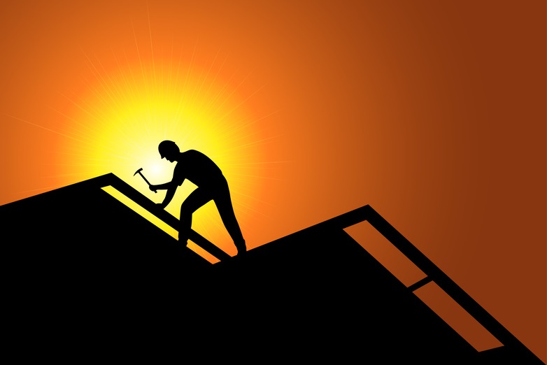 Roofing worker on a new roof.