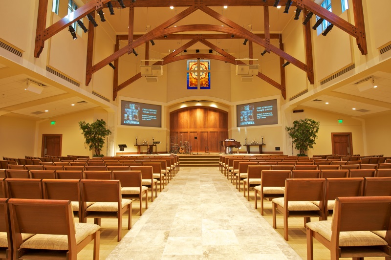 interior of modern church seen from the aisle