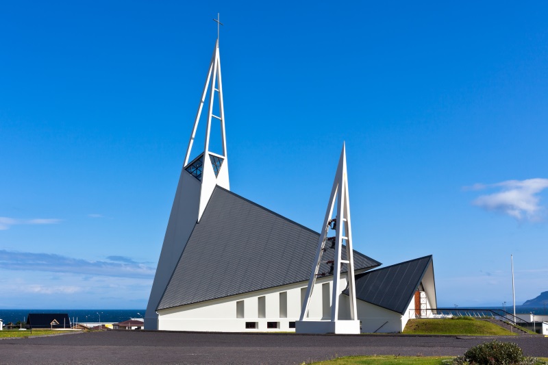 exterior of modern church against a clear blue sky