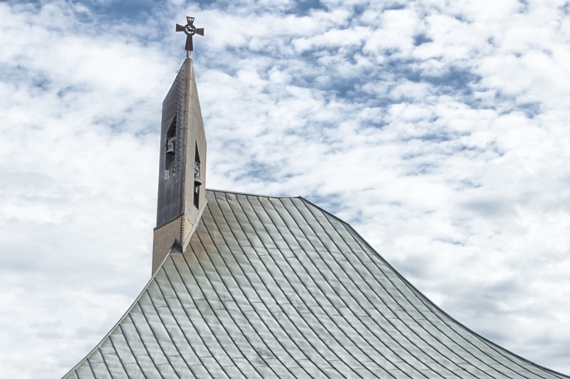 modern church steeple detail with cross at top