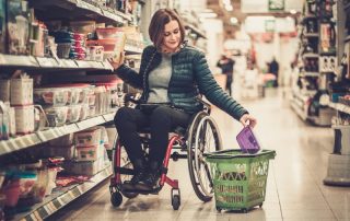 Woman using wheelchair shopping