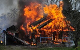 Wildfire burning home