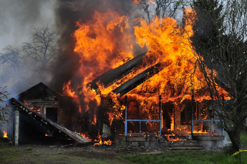 Wildfire burning home