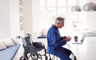 man in wheelchair in kitchen