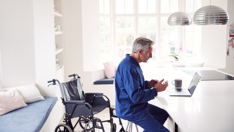 man in wheelchair in kitchen