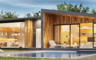 Exterior of modern home with wood frame and large glass windows, overlooking a pool