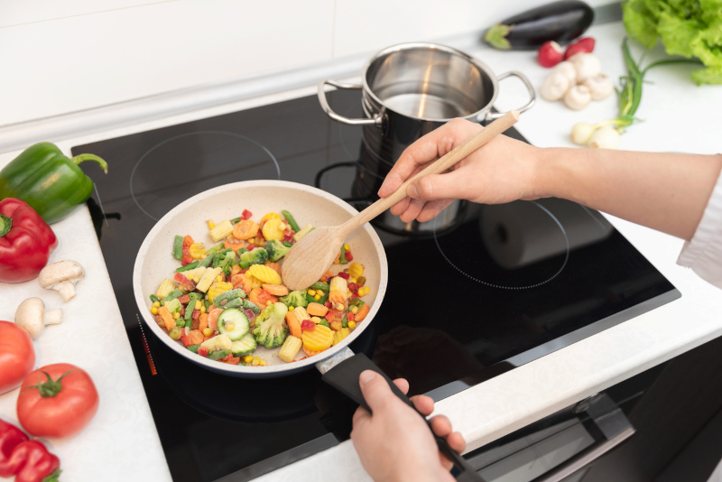 Fresh vegetables fried in a pan. Healthy nutrition concept. Healthy nutrition concept