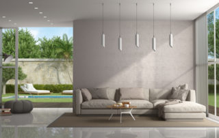 Brown living room of a modern villa with pool on background - 3d rendering Note: the room does not exist in reality, Property model is not necessary