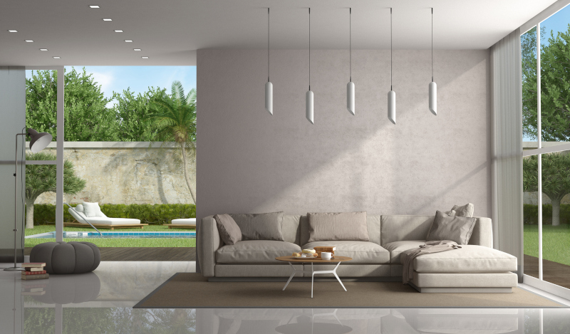 Brown living room of a modern villa with pool on background - 3d rendering Note: the room does not exist in reality, Property model is not necessary