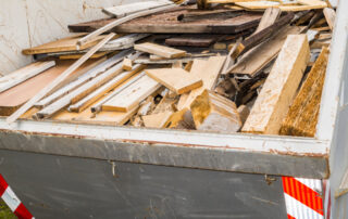 Garbage container with broken wood pieces