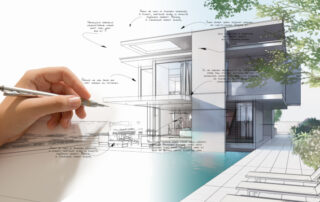 Hand ith pencil working on a 3-D architectual drawing