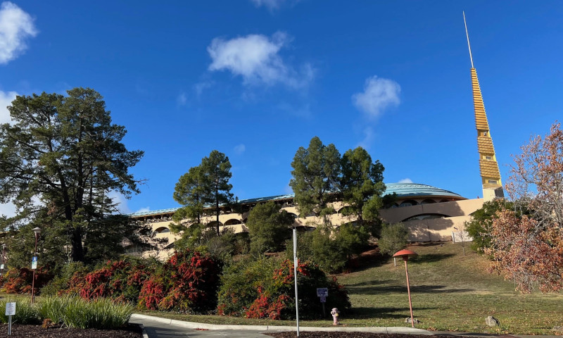 Marin County Civic Center. Modern, beige building with blue tile roof nestled among gentle hills