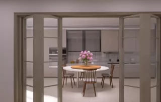 Room with floor-to-ceiling patio doors opening to a round white table with wood chairs and a bouquet of pink flowers.